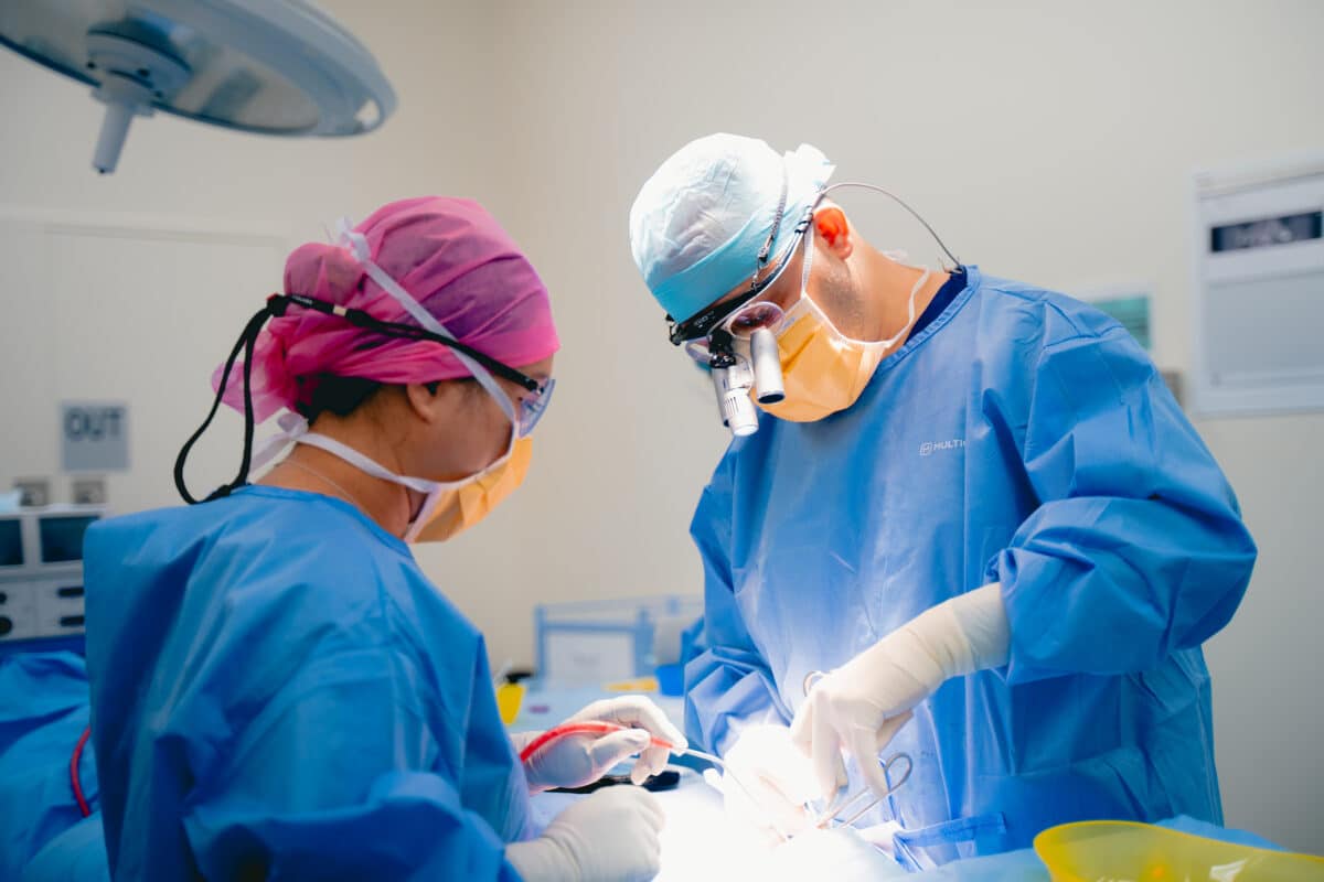 Clinical team performing a dental procedure